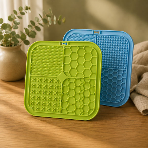 Golden retriever licking peanut butter off the Calm Lick Mat, a blue silicone slow feeder